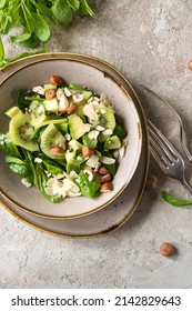 Bowl Of Salad With Spinach, Kiwi And Avocado On The Table