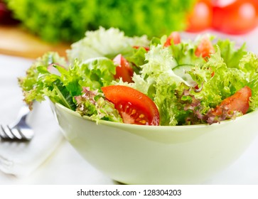 bowl of  salad with vegetables and greens - Shutterstock ID 128304203