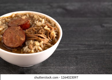 A Bowl Of Sausage And Chicken Gumbo With Rice