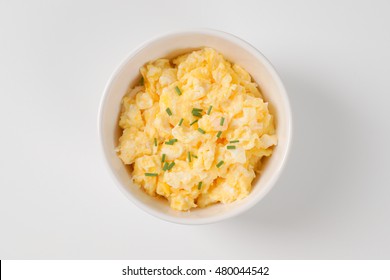 Bowl Of Scrambled Eggs On White Background