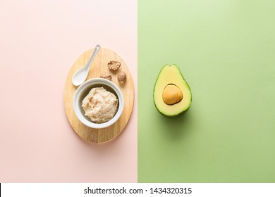 Bowl With Shea Butter And Avocado On Color Background