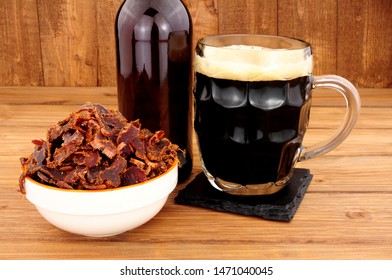 Bowl of shredded biltong meat on a wooden background