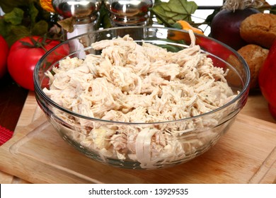 Bowl Of Shredded Chicken Breast In Bowl In Kitchen Or Restaurant.