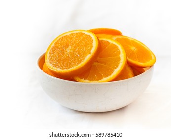 A Bowl Of Sliced Oranges