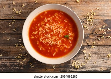 bowl of soup and alphabet noodles - Shutterstock ID 2084898283
