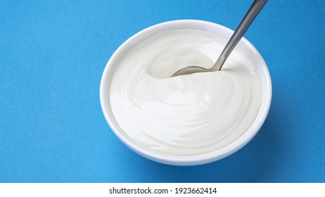 Bowl Of Sour Cream, Greek Yogurt With Spoon, Top View
