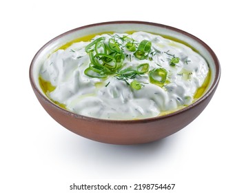 bowl of sour cream or greek yogurt tzatziki sauce isolated on white background - Shutterstock ID 2198754467