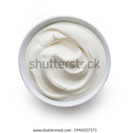 bowl of sour cream or greek yogurt isolated on white background, top view