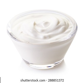 Bowl of sour cream isolated on white background