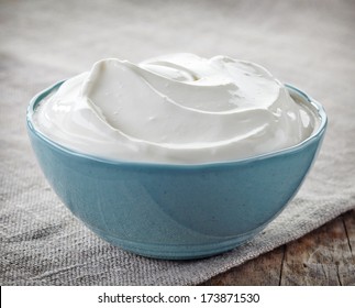 Bowl Of Sour Cream On Linen Napkin