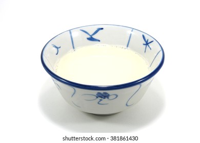 Bowl Of Soy Milk On White Background