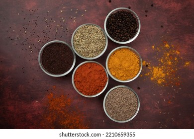 BOWL OF SPICES:
The Image Is All About The Indian Basic Spices Used In Almost All Food For Tempering(chilli Powder,turmeric Powder,mustard,fennel Seed,cumin Seed,peppercorn)
