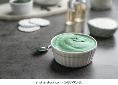 Bowl Of Spirulina Facial Mask On Grey Table