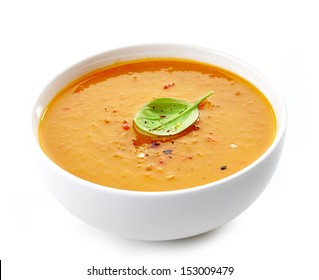 Bowl of squash soup isolated on a white background