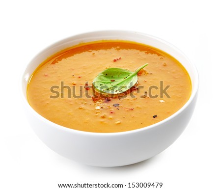 Bowl of squash soup isolated on a white background
