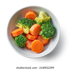 Bowl Of Steamed And Roasted Carrots And Broccoli Isolated On White Background, Top View