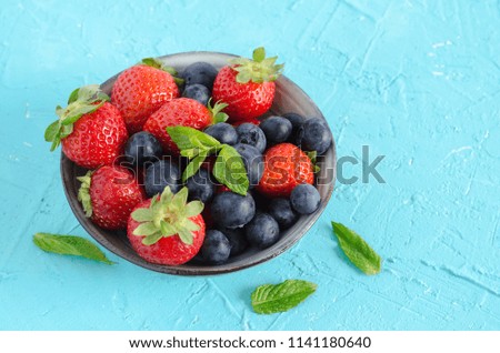 Similar – Bowl with red berries and mint leaves