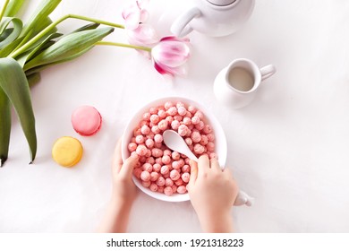 Bowl With Strawberry Sweet Corn Balls. Delicious And Healthy Breakfast Cereal. Kid Hand Take A Spoon And Eating