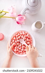 Bowl With Strawberry Sweet Corn Balls. Delicious And Healthy Breakfast Cereal. Kid Hand Take A Spoon And Eating