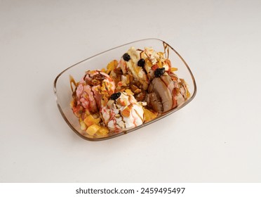 A  bowl of Strawberry, Vanilla, Saffron and Chocolate Ice cream with Fresh Fruits, Dry Fruits and nuts - Powered by Shutterstock