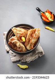 A Bowl Of Stuffed Tofu Served With Raw Chili