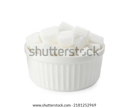 Bowl of sugar cubes isolated on white