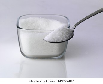 Bowl Of Sugar With Metal Spoon