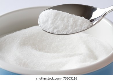 Bowl Of Sugar With Metal Spoon