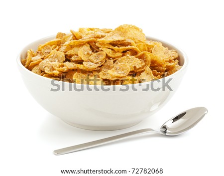 bowl of sugar-coated corn flakes and spoon isolated on white