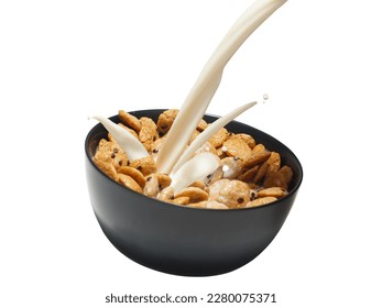 A bowl of sweet crisp cookie cereal with fresh milk pouring splashing studio shot isolated on white background