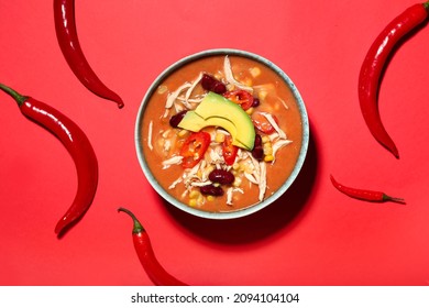 Bowl Of Tasty Chicken Enchilada Soup On Color Background