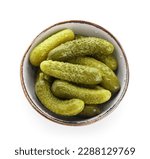 Bowl with tasty fermented cucumbers on white background