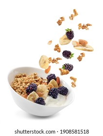 Bowl with tasty granola, yogurt and fruits on white background