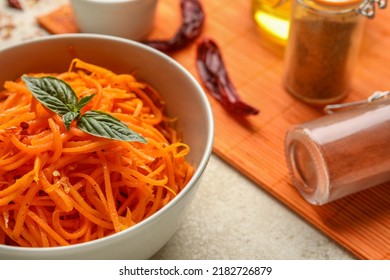 Bowl Of Tasty Korean Carrot Salad On Table, Closeup