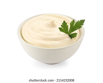 Bowl of tasty mayonnaise with parsley isolated on white
