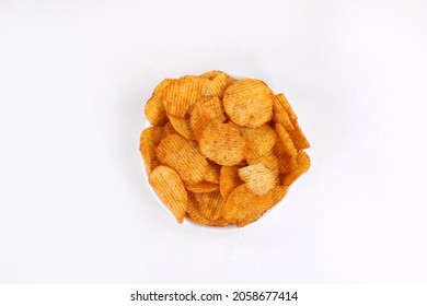 Bowl of tasty ridged potato chips on white background | top angle beautiful focused - Powered by Shutterstock