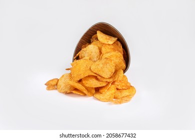 Bowl of tasty ridged potato chips on white background beautiful focused - Powered by Shutterstock