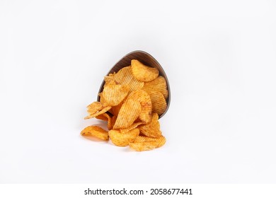 Bowl of tasty ridged potato chips on white background | top angle beautiful focused - Powered by Shutterstock