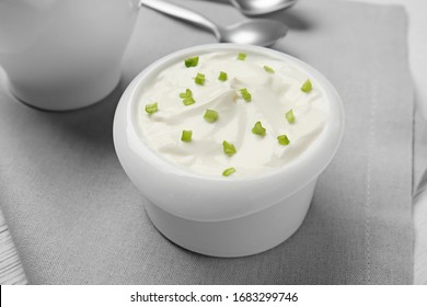 Bowl Of Tasty Sour Cream On Table