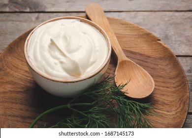 Bowl Of Tasty Sour Cream On Table