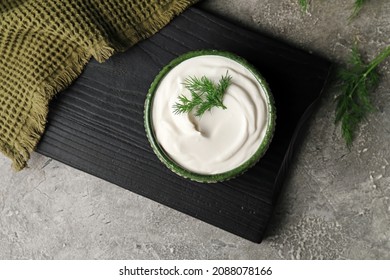 Bowl Of Tasty Sour Cream On Grunge Background