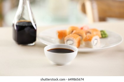 Bowl With Tasty Soy Sauce On Table