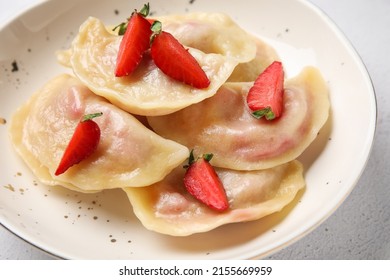 Bowl with tasty strawberry dumplings, closeup