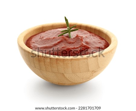 Bowl with tasty tomato paste and rosemary on white background