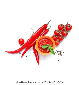 Bowl of tomato sauce with basil, chili peppers and peppercorn on white background - Powered by Shutterstock