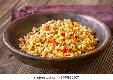 Bowl of traditional egg fried rice on wooden background - Powered by Shutterstock