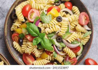 A bowl with traditional Italian pasta salad - Powered by Shutterstock