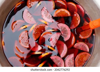 Bowl Of Traditional Sangria Or Punch Made Of Red Wine With Lemon Slices, Top View. Homemade Alcoholic Drink With Citrus Fruits For Party Or Celebration, Closeup. Cocktail Bar Beverage