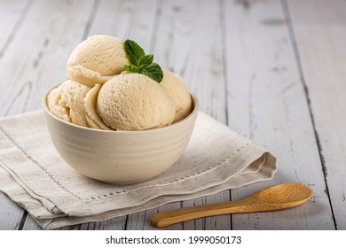 Bowl with vanilla ice cream balls.