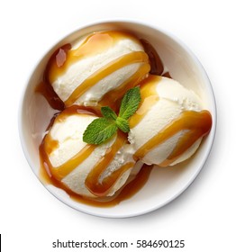 Bowl Of Vanilla Ice Cream And Caramel Sauce Isolated On White Background. From Top View